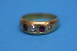 An 18ct gold diamond and ruby ring, total weight 4.7gram