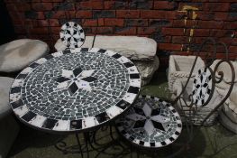 A wrought iron and tile top garden table and 2 cha