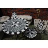 A wrought iron and tile top garden table and 2 cha