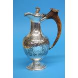 An engraved silver plated water pot with swept bon