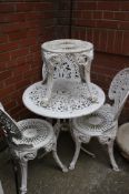 An aluminium garden table, 3 chairs and a stool