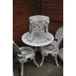 An aluminium garden table, 3 chairs and a stool