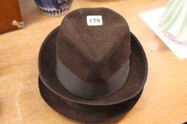 A Stetson, Trilby and one other