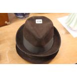 A Stetson, Trilby and one other