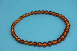 A Baltic amber coloured necklace