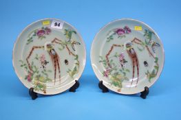 A pair of Canton enamelled plates, 20cm diameter