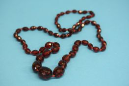 A red amber coloured necklace