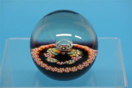 A boxed Caithness 'Myriad' paperweight
