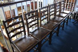 Six oak ladder-back chairs