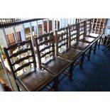 Six oak ladder-back chairs