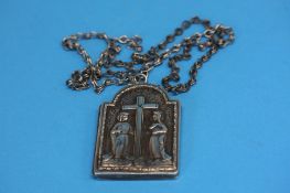 A 19th century silver religious locket, the revers