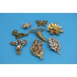 Eight various costume jewellery brooches