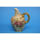 A Royal Worcester flat back jug decorated with flo