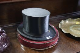 A collapsible German top hat and box
