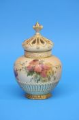 A Royal Worcester vase and cover decorated with ch