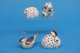 Four Royal Crown Derby paperweights, including a m