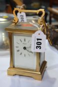 A carriage clock and key, signed Angelus