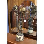 A Spelter candelabra in the form of a knight on ma