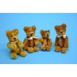 Four miniature teddy bears