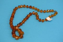 A faceted amber coloured necklace