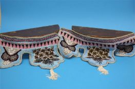 A Pair of half moon hanging wall shelves with shap