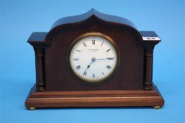 An Edwardian mantel clock with circular white dial