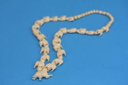 A carved Ivory elephant necklace