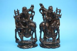 A pair of modern Chinese hardwood Immortals, 32.5c