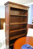 An open carved oak 'Old Charm' bookcase