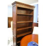 An open carved oak 'Old Charm' bookcase