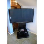 Panasonic TV and Blu Ray player on stand