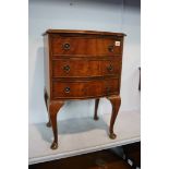 Serpentine walnut chest of drawers