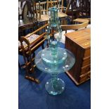 Two glass top side tables