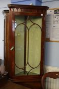 A Chapmans of Newcastle reproduction mahogany corner cabinet