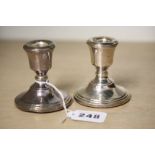 Pair of dwarf silver candlesticks