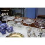 Nine pressed glass cake stands