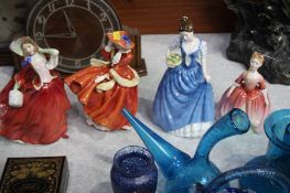 Four Royal Doulton figures