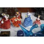 Four Royal Doulton figures