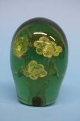 A Victorian green glass dump with six flower heads