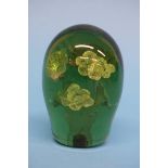 A Victorian green glass dump with six flower heads