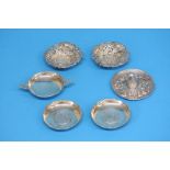 A pair of silver pierced bon bon dishes, a small silver dish, a sterling silver Mexican hat and a