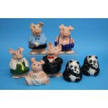 A set of five Nat West pigs and two Nat West panda
