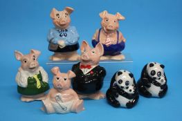 A set of five Nat West pigs and two Nat West panda