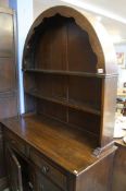 An Oak linenfold dresser and an oak drinks cabinet