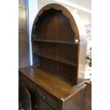 An Oak linenfold dresser and an oak drinks cabinet
