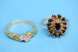 A 9ct gold diamond crossover ring and a sapphire cluster ring