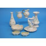 Nine pieces of Belleek china, two small cream jugs