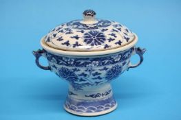 A Chinese blue and white rice warmer with two loop