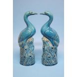 A pair of Continental tin glaze models of storks w