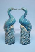 A pair of Continental tin glaze models of storks w